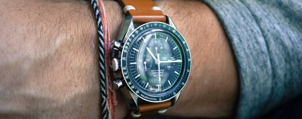 A close-up image of a stylish Omega wristwatch on someone's arm.