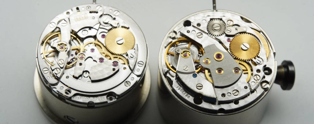 A close-up photo of the intricate mechanics inside a Rolex watch movement.