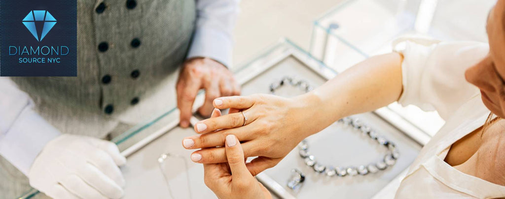 Image depicting a person presenting diamond jewelry to potential buyers