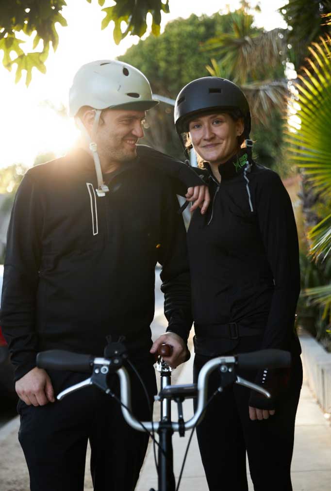 Dillon and Sanda standing behind a bike