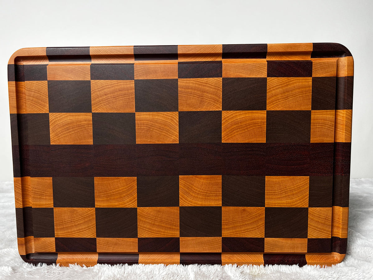 African Padauk and Maple wood end grain cutting board. 15” x 12” x 1.25”