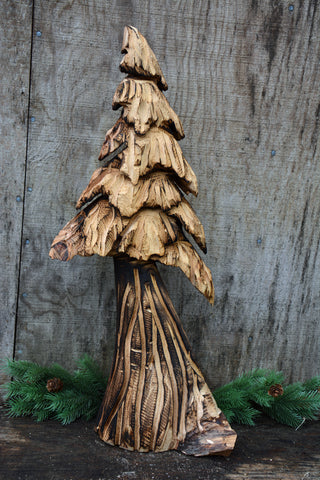 Wall hanging tree sculpture chainsaw carving from california cedar. perfect decor for your outdoorsy, nature theme aesthetic, organic artwork from raw timber is perfect for your cabin or vacation home. one-of-a-kind handmade sculptures make for perfect presents for friends and family