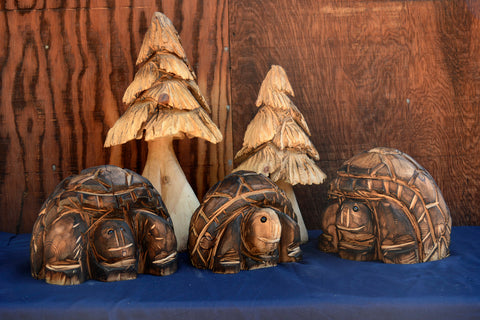 Three Turtle Tortoises with two trees chainsaw carvings from California Cedar by Artist Jess Alice. These adorable wood sculpture characters and nature scene is a sure to enchance any space indoors or outdoors