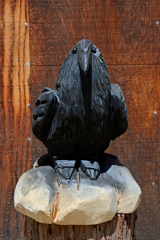 Chainsaw carven raven crow from california cedar. wood sculpture by artist jess alice one-of-a-kind handmade wood carving of a perched raven sitting on a log. perfect accent decor for your home, yard, garden or business.
