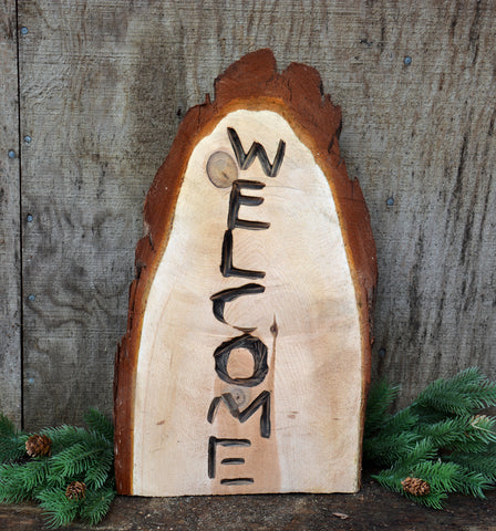 Welcome sign chainsaw carved california cedar by artist Jess Alice.