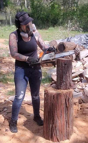 Artist and Woman Chainsaw Carver Jess Alice in action carving California cedar log into a one-of-a-kind wood sculpture. Great, unique home decorations, gift idea and overall fun accent for home, yard, garden , office and business decor