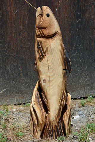 2ft jumping fish chainsaw carved wood sculpture. Artist Jess Alice California Cedar wood sculpture of a jumping with surrounded by waves