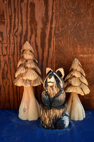 Raccoon Rustic Home 3d wood sculpture in log. chainsaw carved from california cedar unique hand-made artwork by female chainsaw artist Jess alice. cute raccoon carving with two trees perfect for your cabin, home, business, garden accents