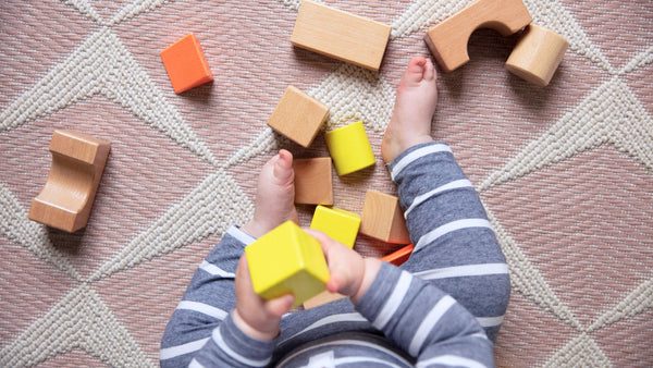 baby playing with blocks