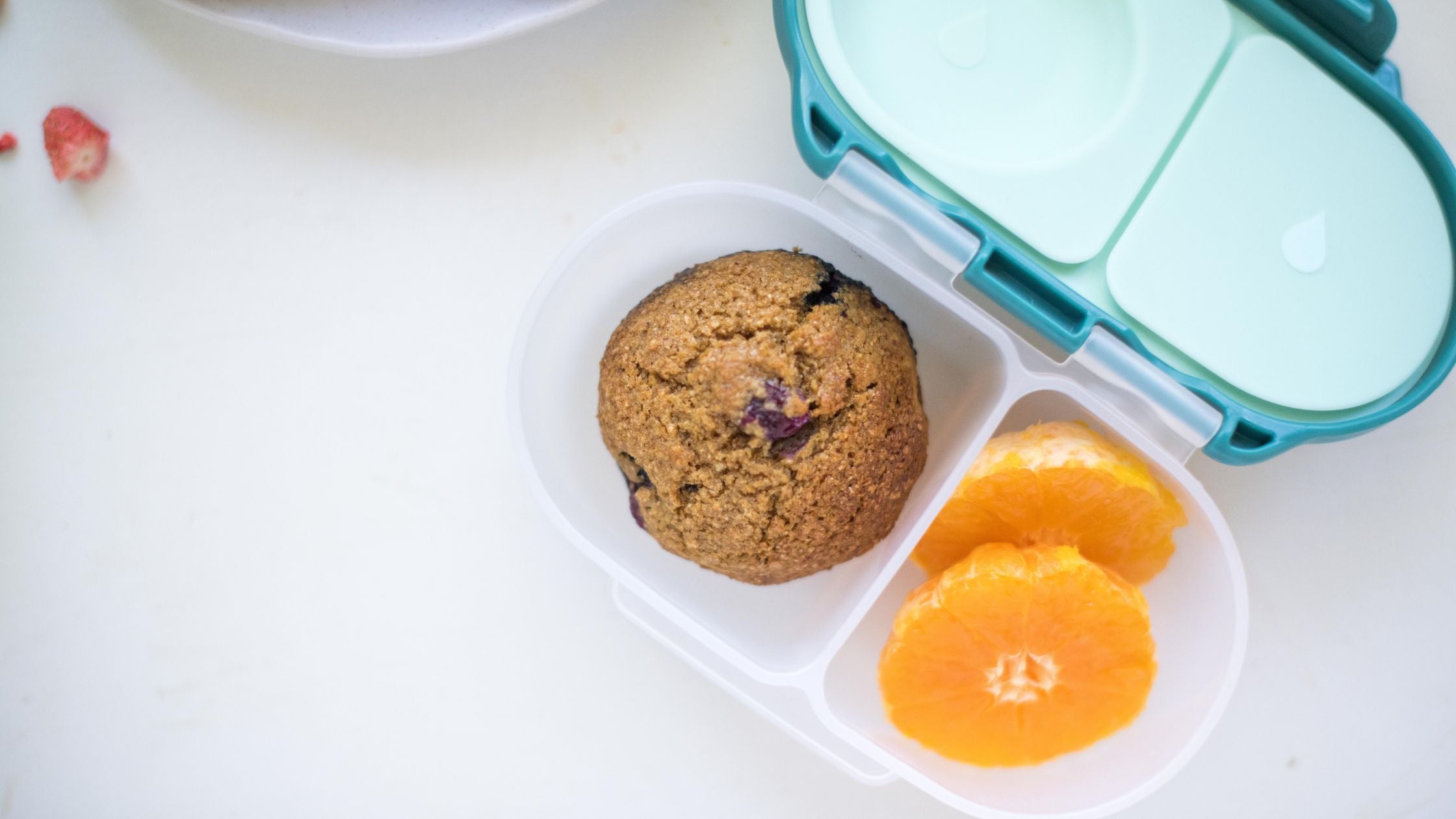 snackbox with blueberry muffin and orange