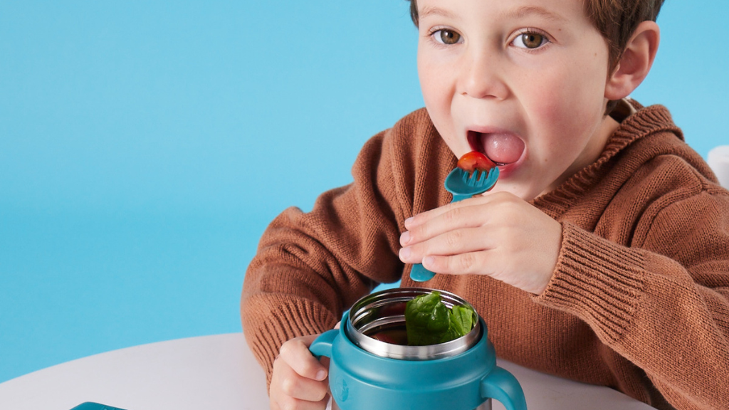 child with b.box for kids insulated food jar