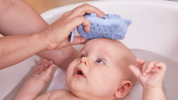 using baby bath brush + sponge on baby scalp