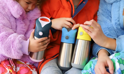 kids holding insulated drink bottles