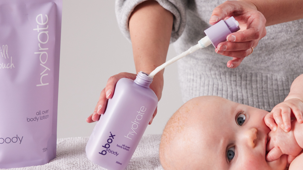 baby using b.box body hydrate lotion and refill