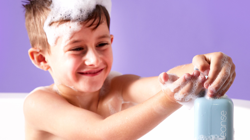 child using b.box body cleanse for skin care layering