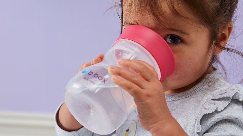 child using b.box for kids training cup