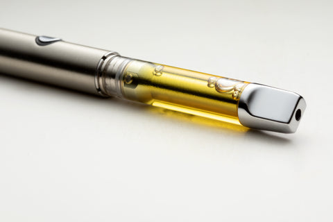 A metallic vape pen in a horizontal position.