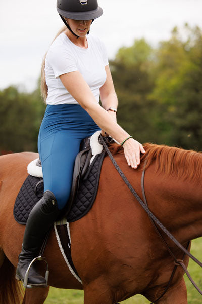 Emiline riding her horse at 16 weeks pregnant