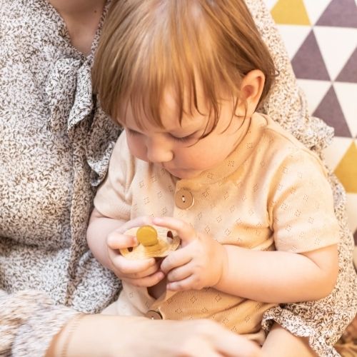 Mark holding a bamboo pacifier