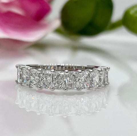 https://www.agidesign.ca/products/ready-to-ship-radiant-cut-lab-created-diamonds-shared-claw-wedding-band
