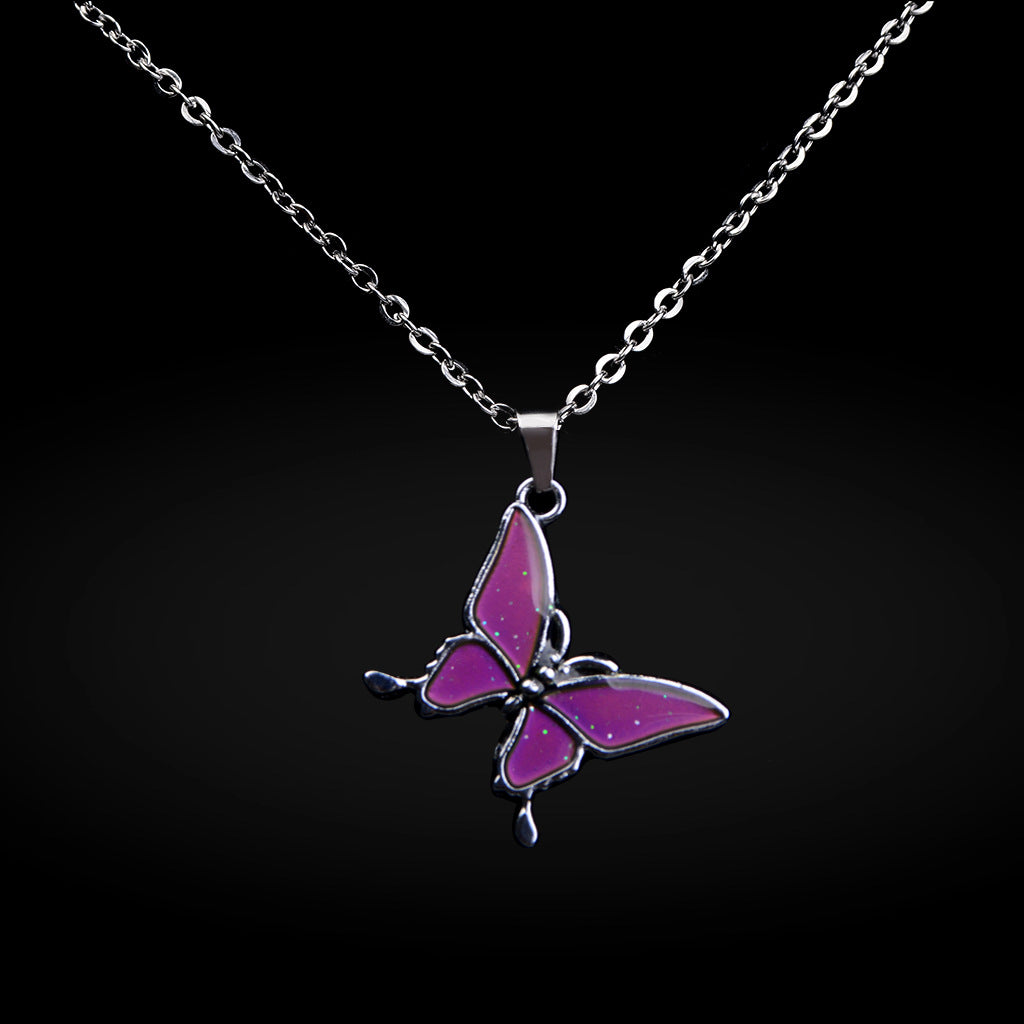 A butterfly necklace that keeps changing color