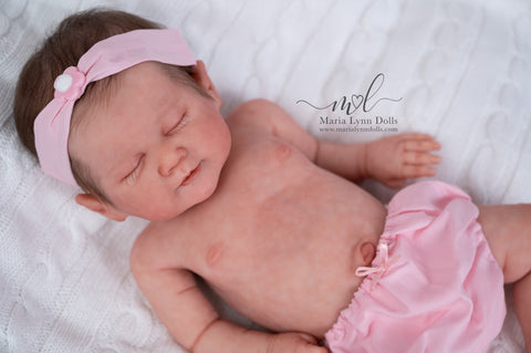 Silicone baby Lily in pink bloomers and headband
