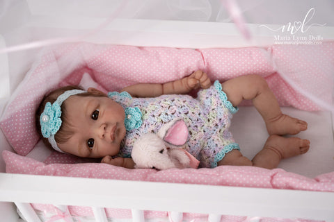 Zoe in a crib