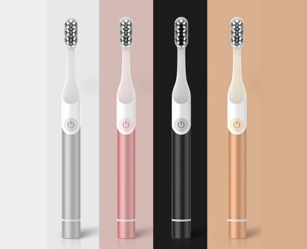 4 XF21 Toothbrushes in various colors.