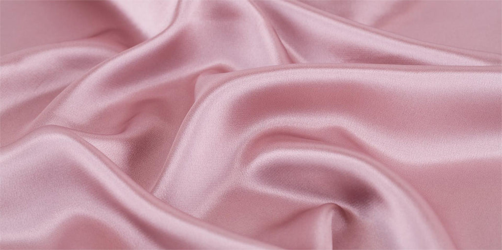 Avantages des draps de lit en soie par rapport à la soie imitation