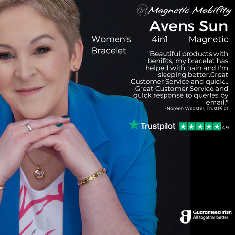 An image featuring a woman smiling, wearing the 'Avens Sun' Women's 4in1 Magnetic Bracelet from Magnetic Mobility. The bracelet's golden finish complements her blue blouse and sophisticated style. A testimonial from Noreen Webster on TrustPilot highlights the product's beauty and pain relief properties, as well as the company's excellent customer service. The TrustPilot rating of 4.9 stars, alongside the Guaranteed Irish logo, attest to the brand's commitment to quality and local business excellence.