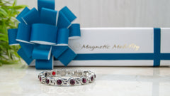 Womens Birthstone Magnetic Bracelets for Christmas - Image shows a February Birthstone Bracelet with a Luxury white gift box and a bow