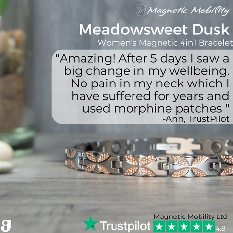 An image showcases the 'Meadowsweet Dusk' Women's Magnetic 4in1 Bracelet from Magnetic Mobility. It features a delicate copper leaf design on the band. A positive customer review by Ann from TrustPilot is prominently displayed, praising the bracelet's impact on wellbeing and significant pain relief in the neck, substituting years of using morphine patches. The company's logo and a high TrustPilot rating of 4.8 stars reflect the product's quality and customer satisfaction.