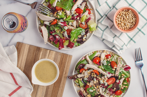 Here's 5 Healthy Recipes for Your Lifestyle: Two Greek chicken gyro salads sits on a white table surrounded by forks and linen napkins.