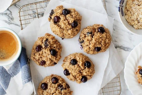 These Breakfast Recipes Will Set You Up for a Healthy Day: Five blueberry oatmeal cookies sit on a baking tray.