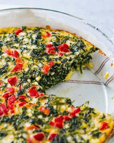 These Breakfast Recipes Will Set You Up for a Healthy Day: A quiche slice sits on a plate with gold cutlery.