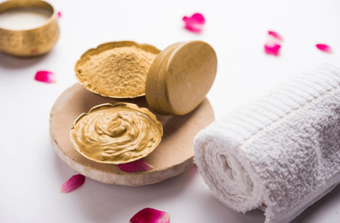 natural multani mitti and towel are on table 