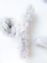 Load image into Gallery viewer, Just pure softness in a hair claw. Each transparent loop hair claw is wrapped in a furry soft light blue gray fabric for those easy to grab, messy hair days.
