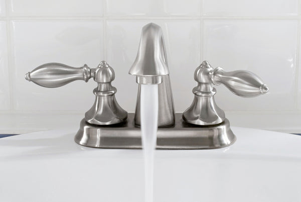 brushed nickel center set faucet with running water