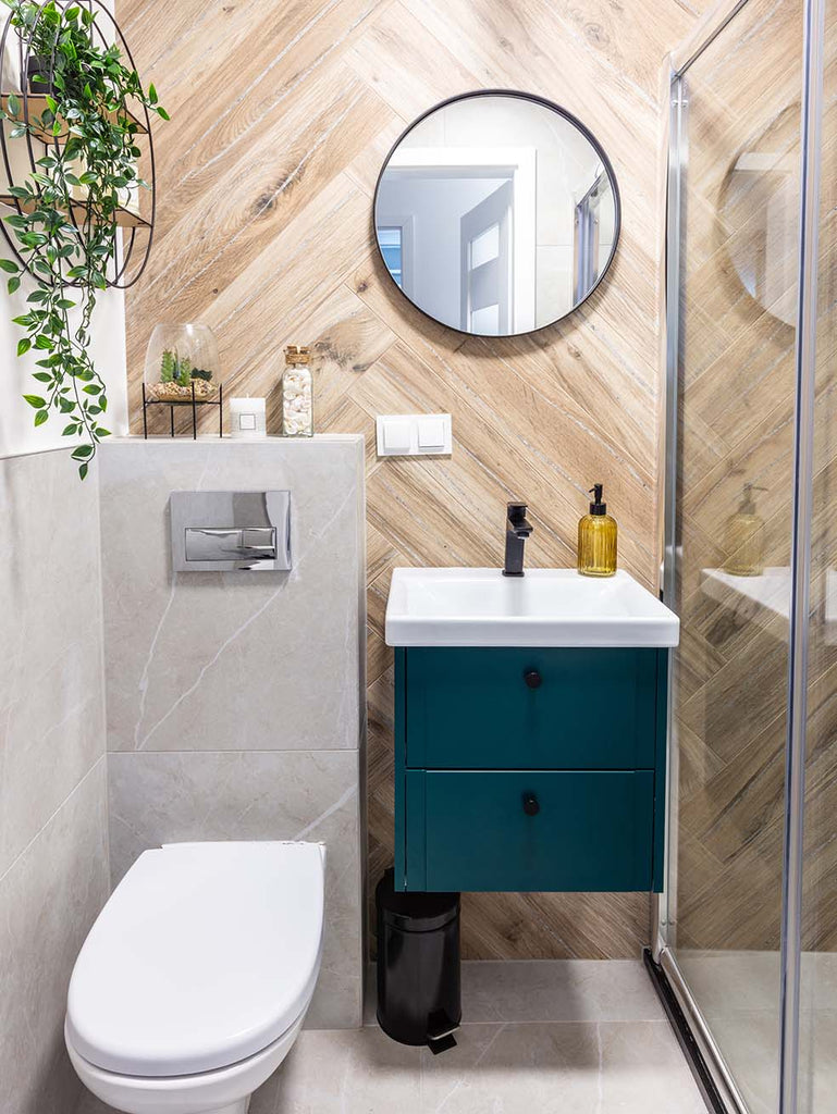 blue vanity contrasted with wooden bathroom wall tiles