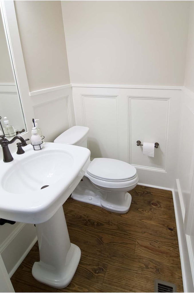 small powder room with pedestal sink and toilet