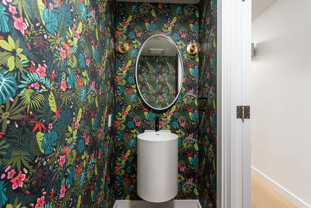 powder room with Veneto Bath floating white stone basin and vibrant green rainforest wallpaper