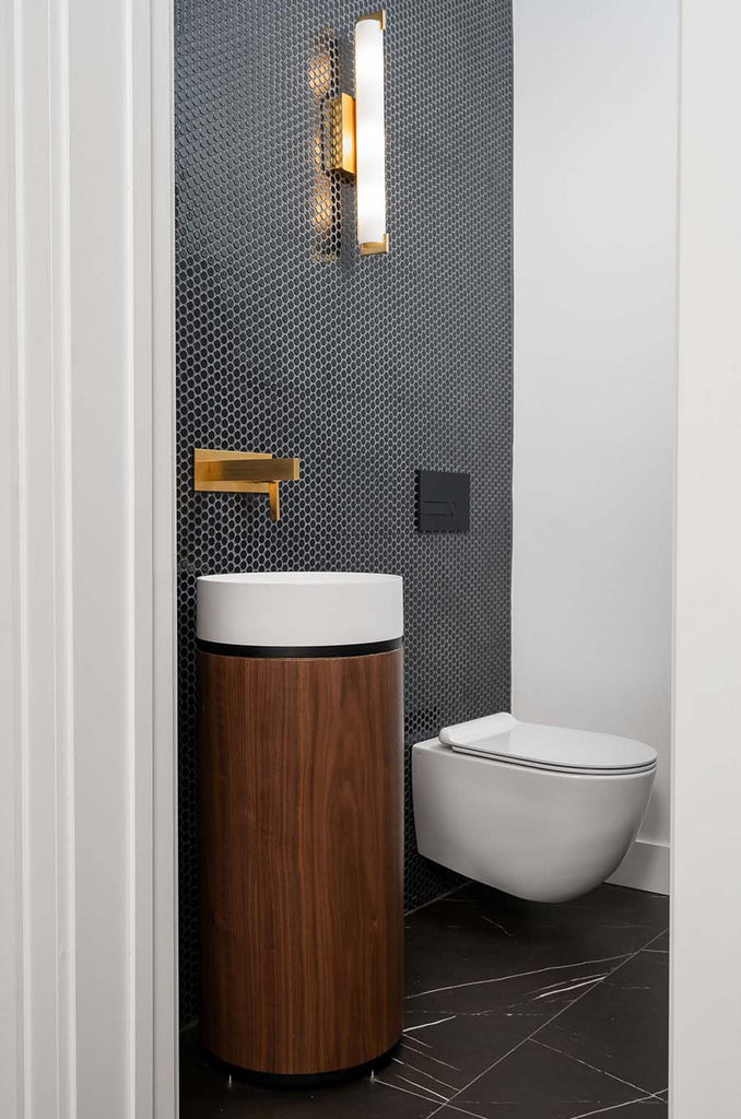 powder room with Veneto Bath walnut pedestal basin and black penny mosaic tiles
