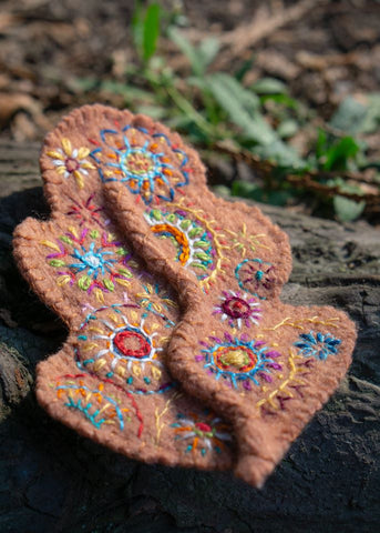 Hand embroidered felt leaf brooch, photo credit Hazel Plater – made from a washed up woollen jumper, and hand-me-down embroidery threads.