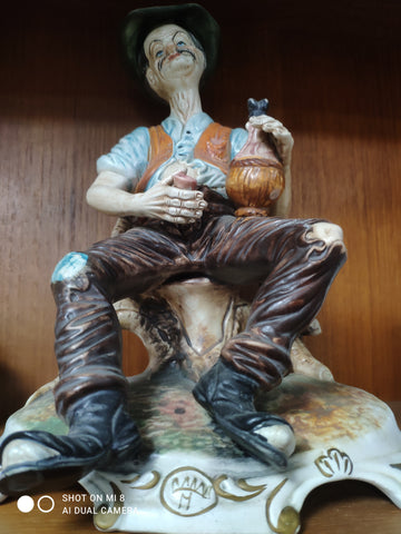 Capodimonte drunkard figure