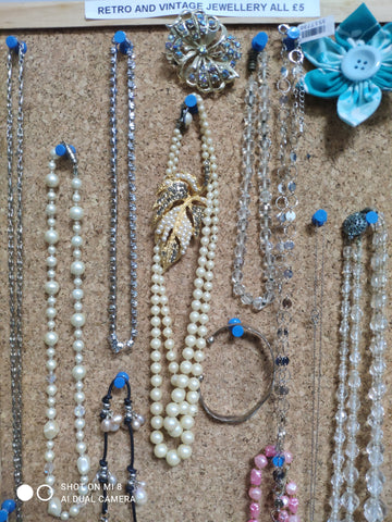 Preloved jewellery on a board