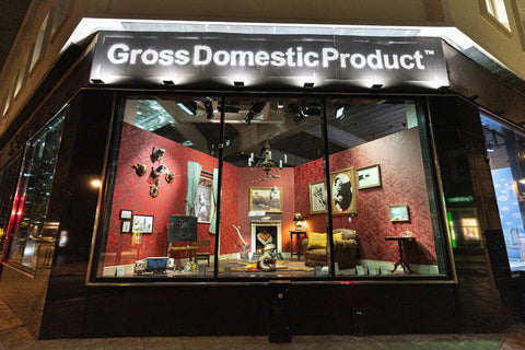 Banksy Gross Domestic Product Store in Croydon. Photo showing various banksy homewares in window, from street view