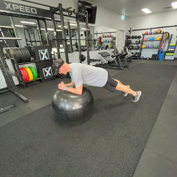 planking on an xpeed gym ball