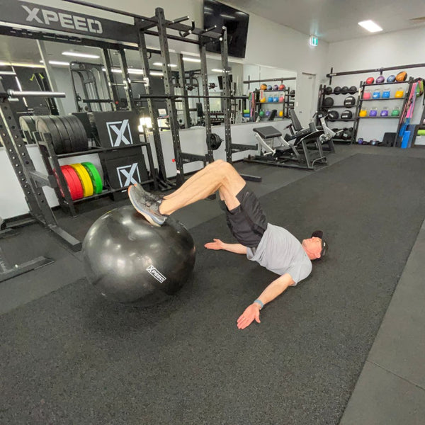 a tough exercise on the xpeed gym ball is a hamstrong curl