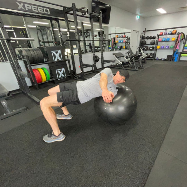 russian twist core exercise on the xpeed gym ball