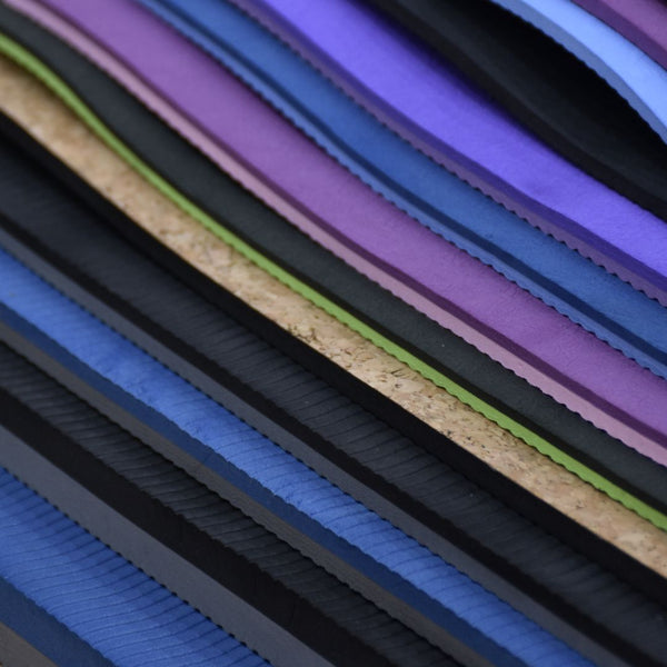 The range of Xpeed yoga and fitness mats, showing their respective thickness